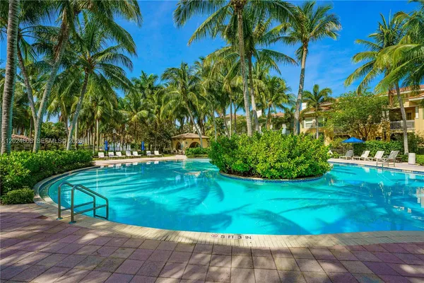 a view of a yard with palm trees