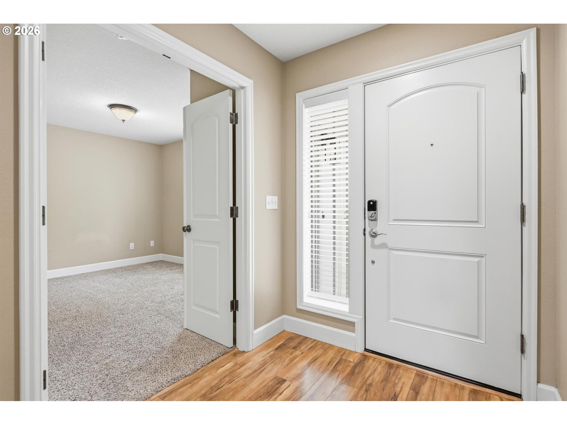 1075 Sage Street Silverton, OR 97381 - Photo 5 of 46 a view of an empty room with wooden floor