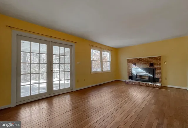 a view of fireplace and wooden floor