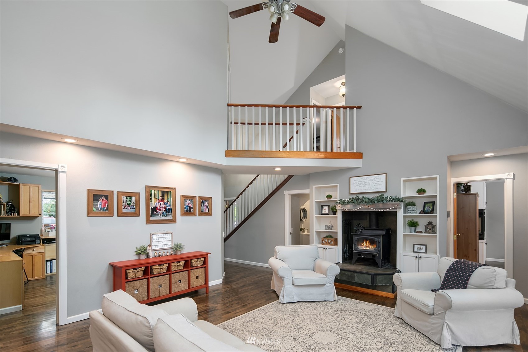 19108 Waxen Road Bothell, WA 98012 - Photo 11 of 31 a living room with furniture and a fireplace