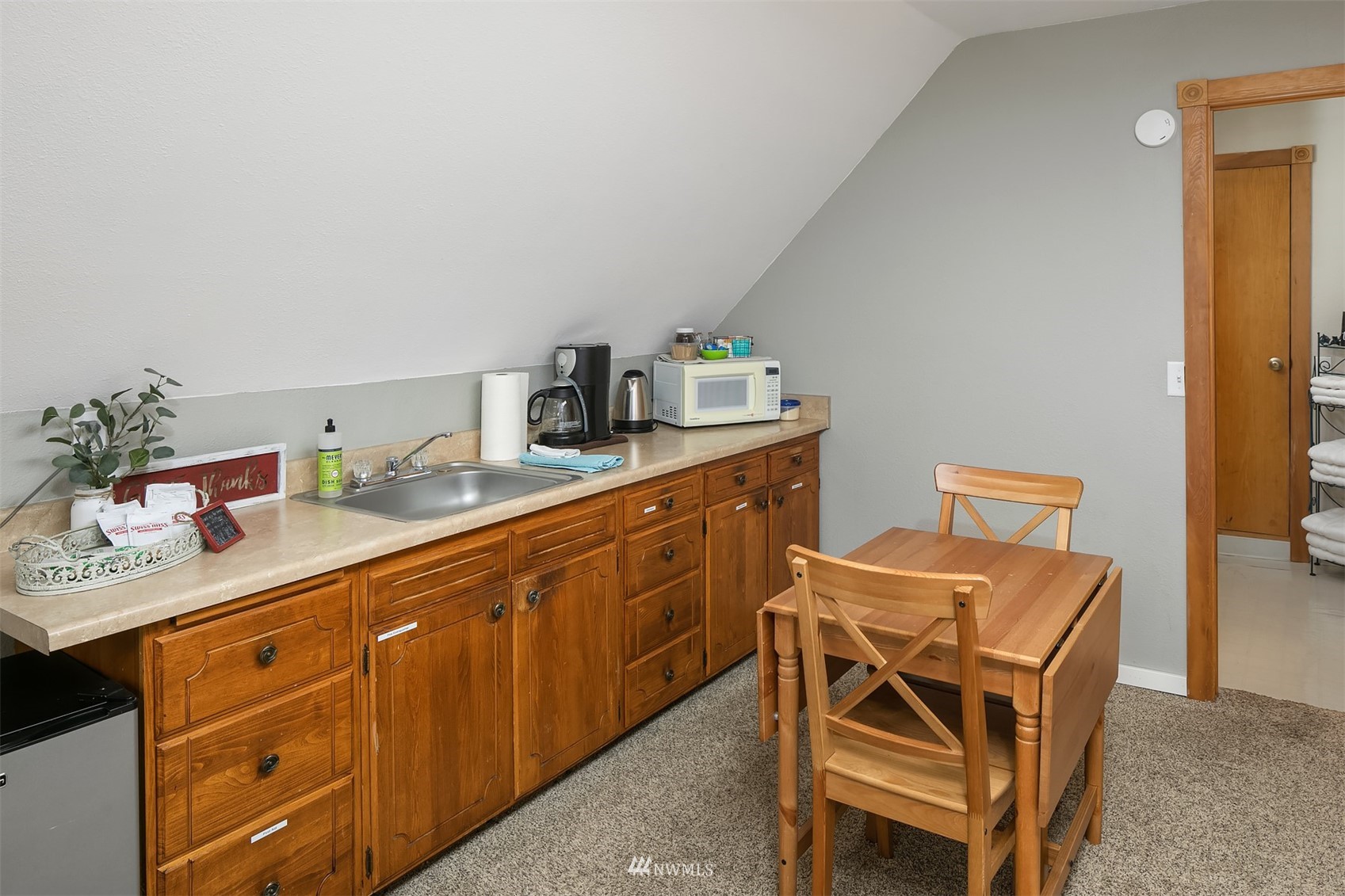 19108 Waxen Road Bothell, WA 98012 - Photo 17 of 31 a dining room with a table and chairs in it