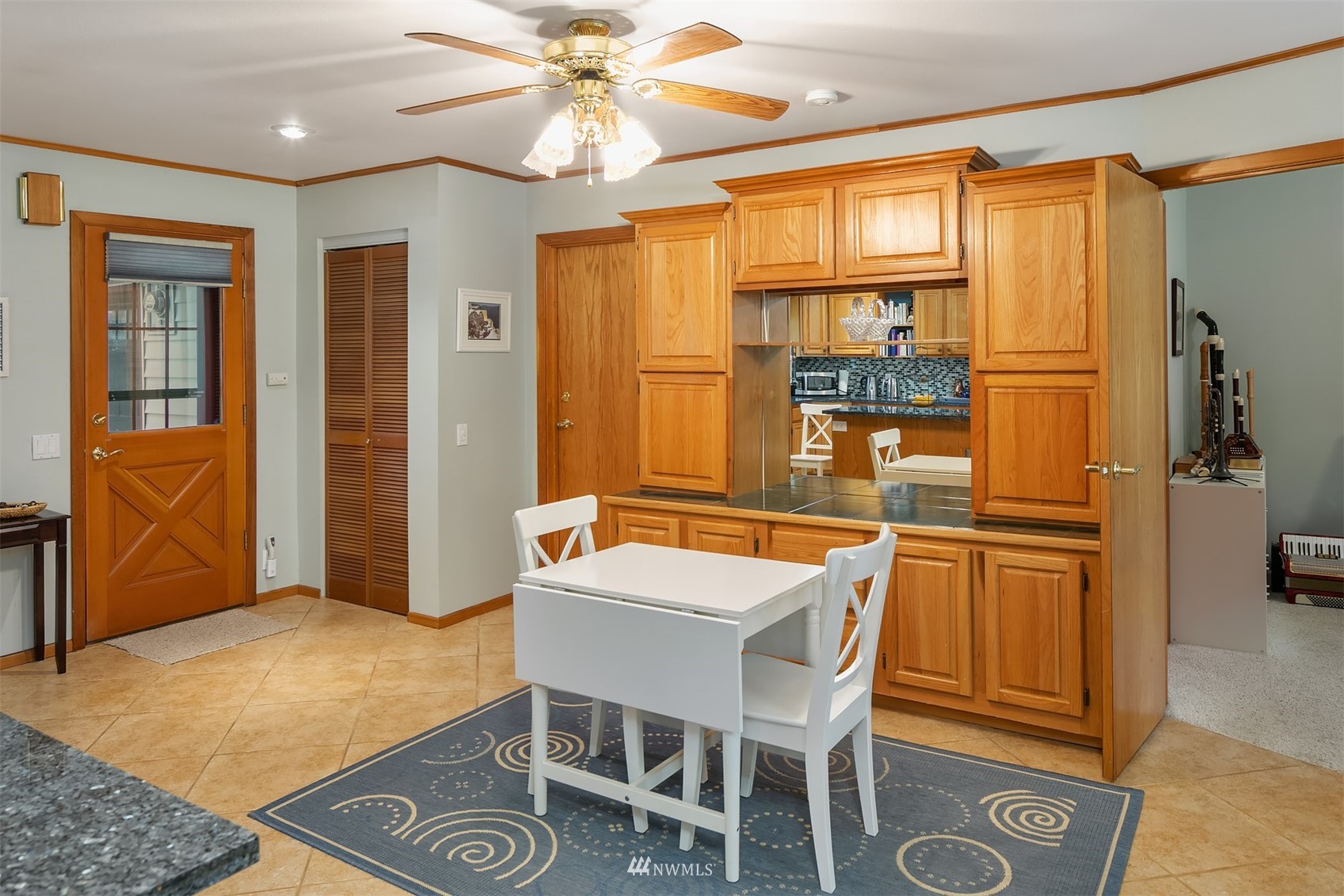 19108 Waxen Road Bothell, WA 98012 - Photo 19 of 31 a dining room with wooden floor and chandelier