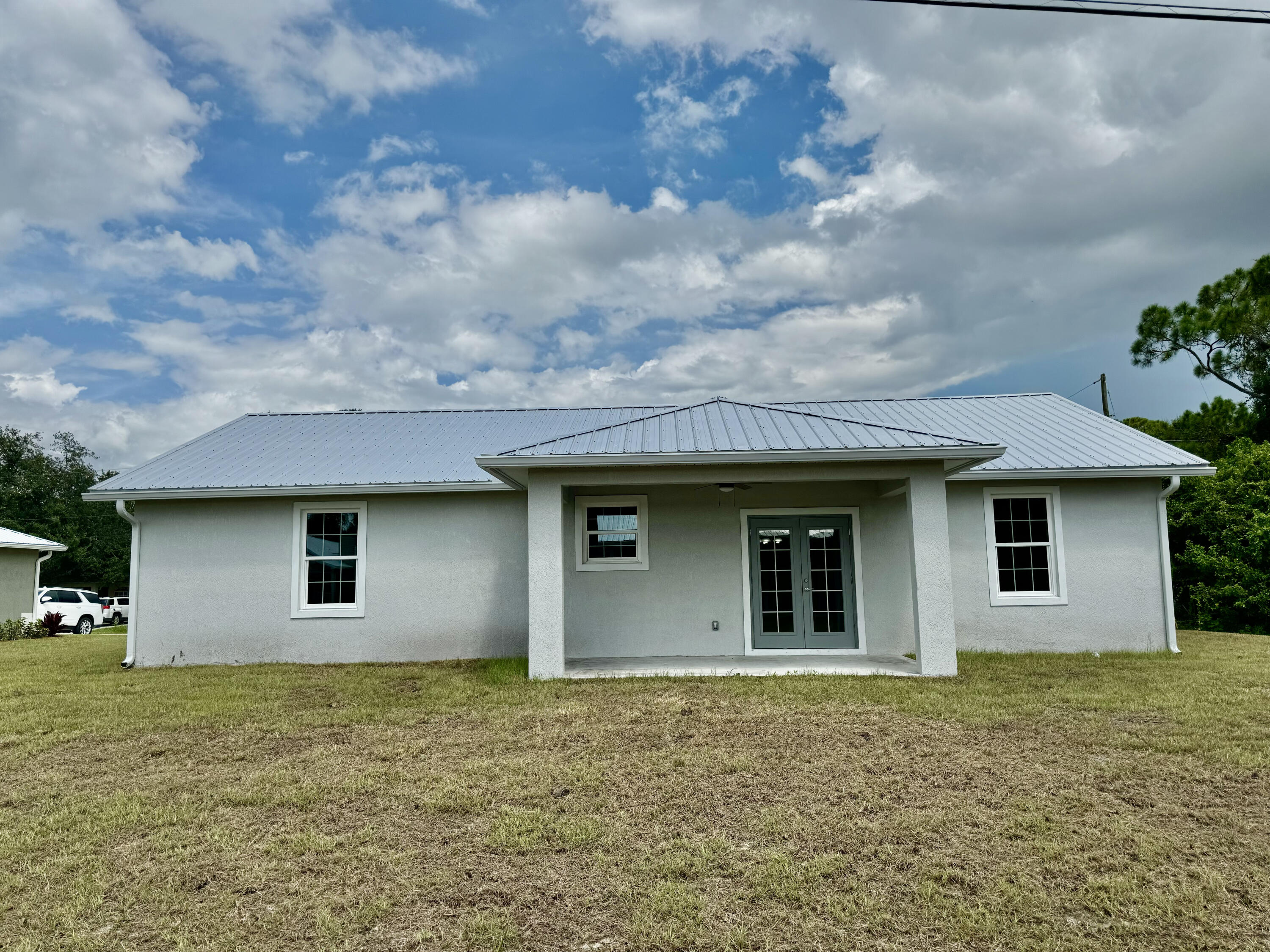 581 Southeast 36th Terrace Okeechobee, FL 34974 - Photo 19 of 19 a backyard of a house with large trees