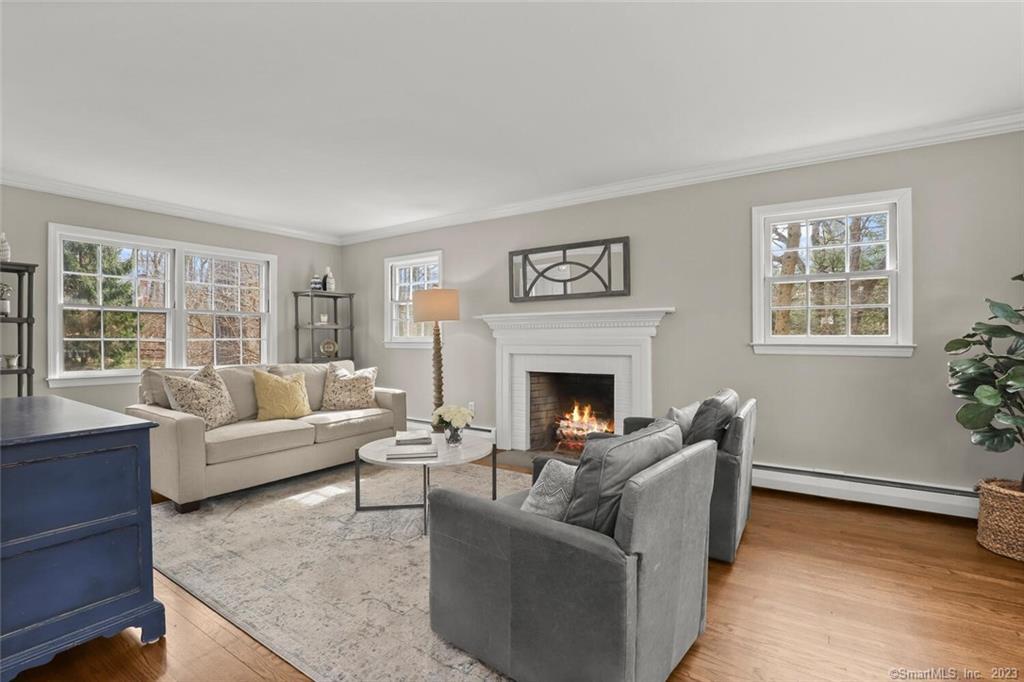 183 Frogtown Road New Canaan, CT 06840 - Photo 6 of 37 a living room with furniture and a fireplace