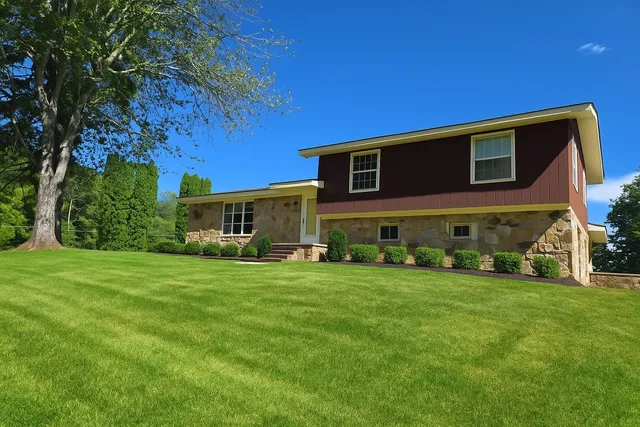 a front view of a house with garden