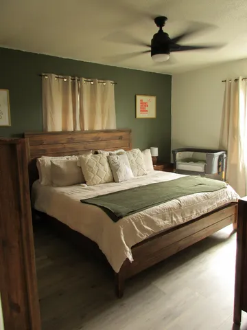 a bedroom with a bed and window