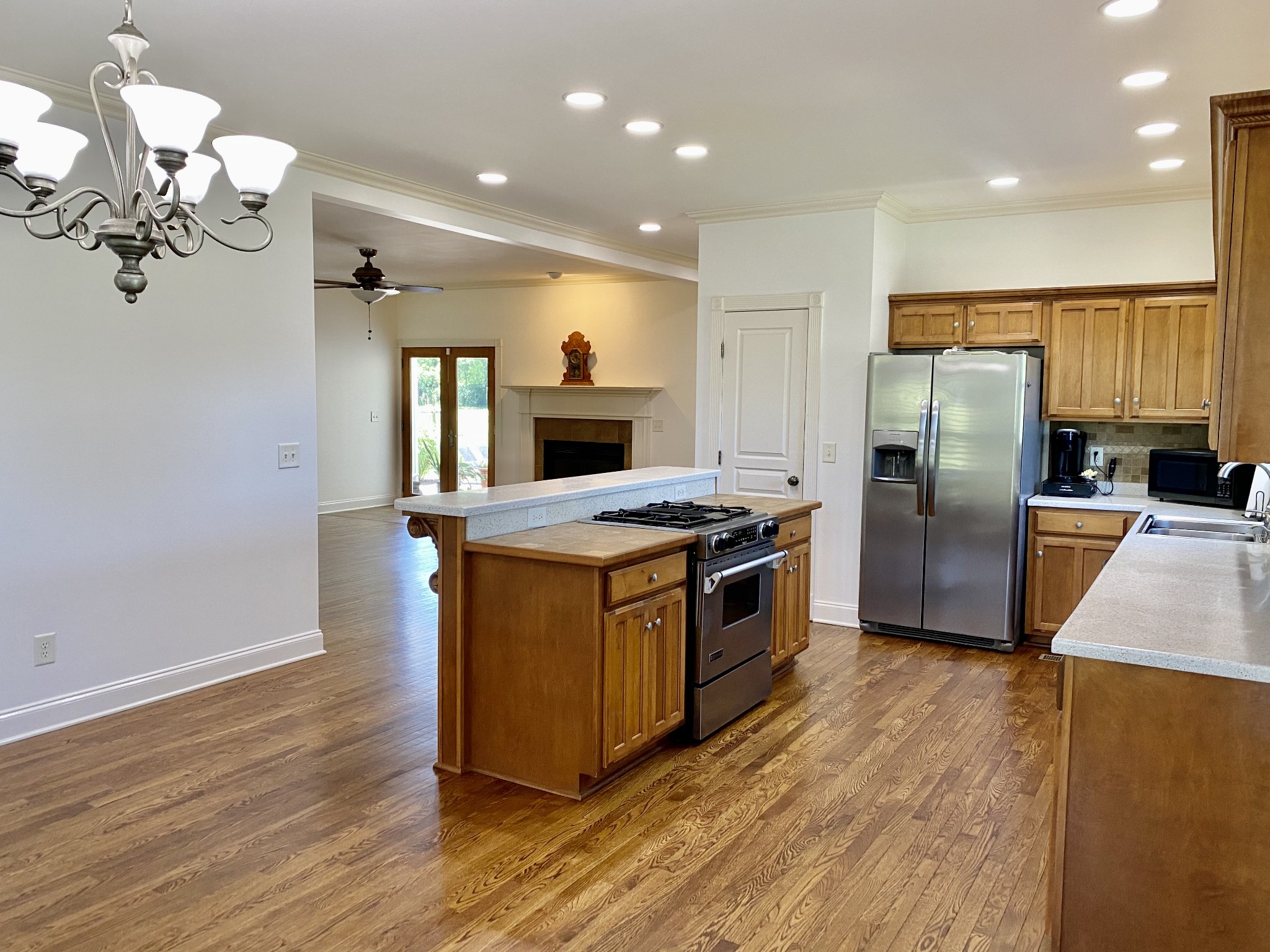 671 Chicken Road Lebanon, TN 37090 - Photo 14 of 46 a kitchen with stainless steel appliances granite countertop a stove a refrigerator and a sink