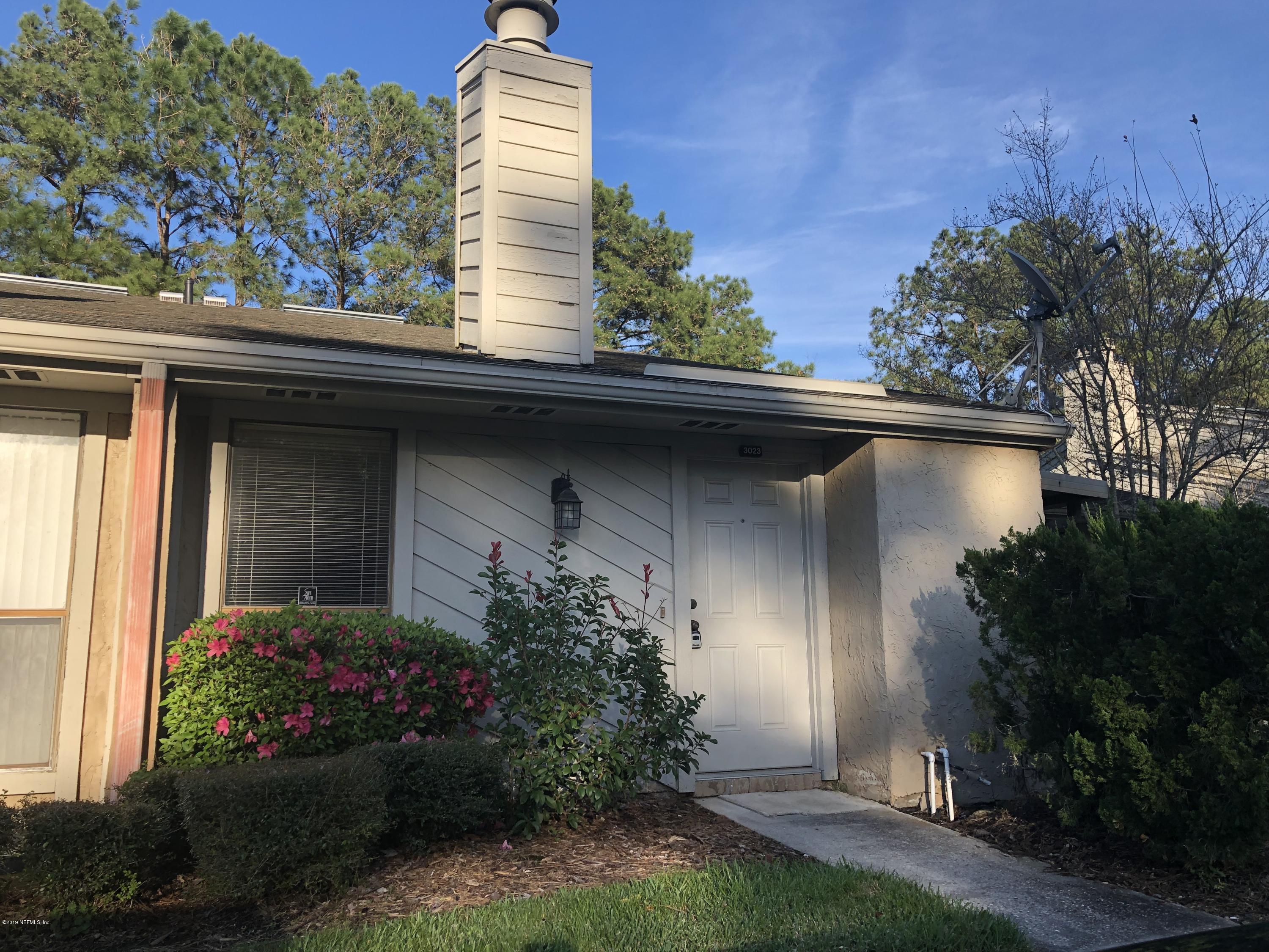 3801 Crown Point Road, Unit 3023 Jacksonville, FL 32257 - Photo 1 of 18 a view of a house with a yard and a garden