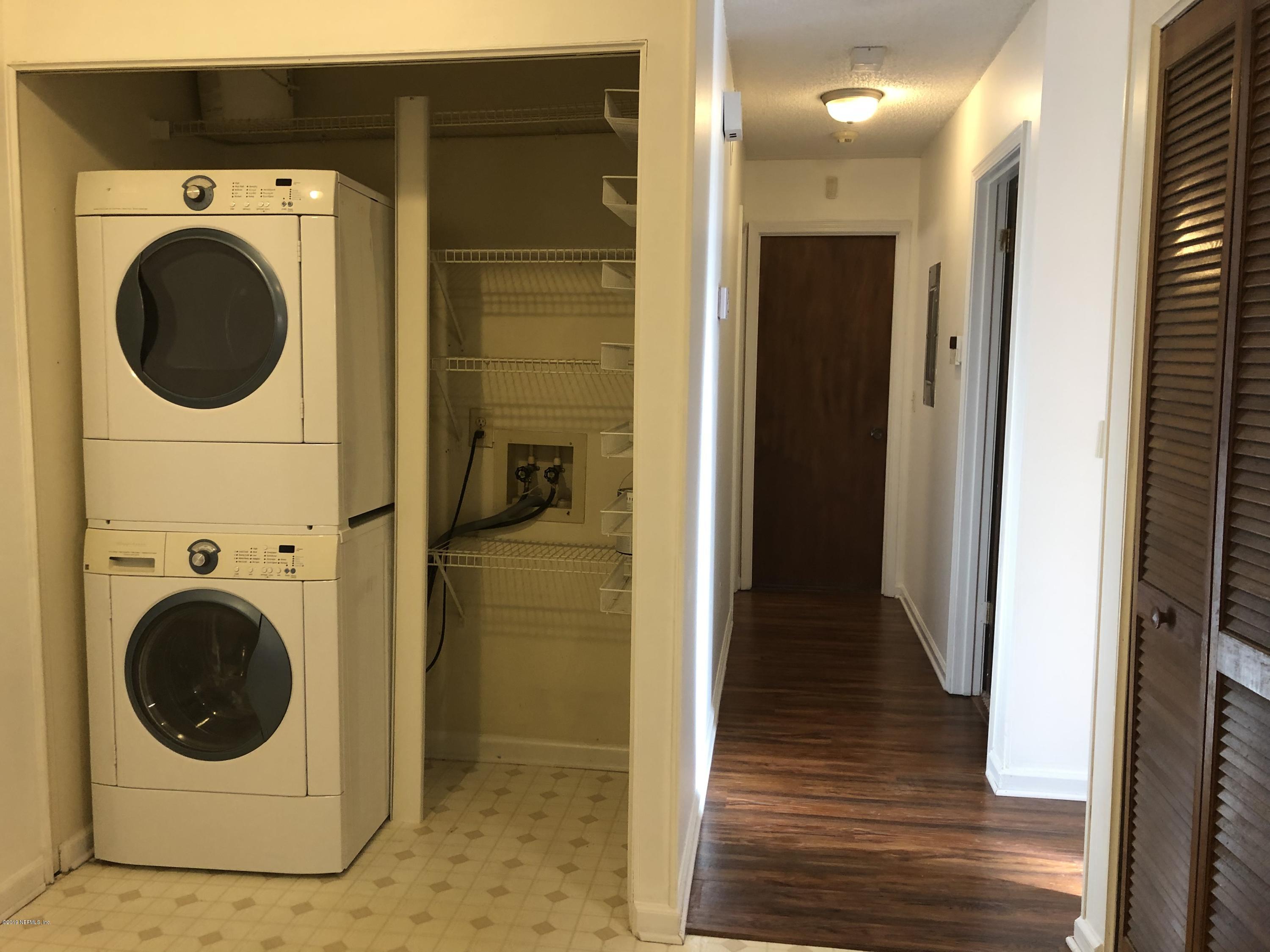 3801 Crown Point Road, Unit 3023 Jacksonville, FL 32257 - Photo 10 of 18 a view of a hallway with washer and dryer
