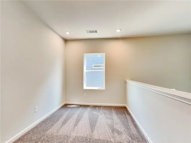 a spacious bathroom with a double vanity sink and a mirror
