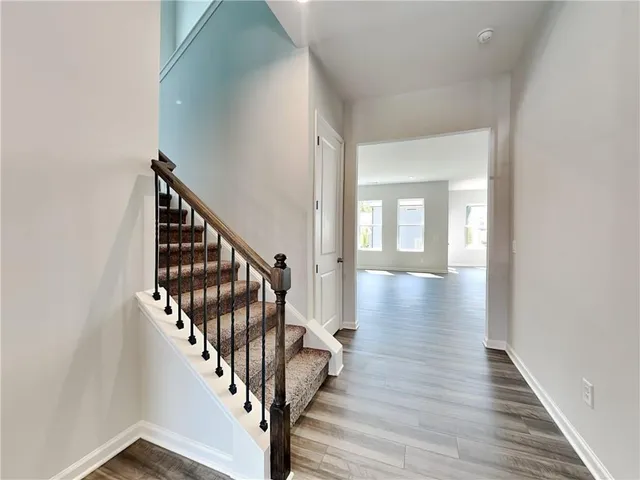 a view of an entryway with wooden floor