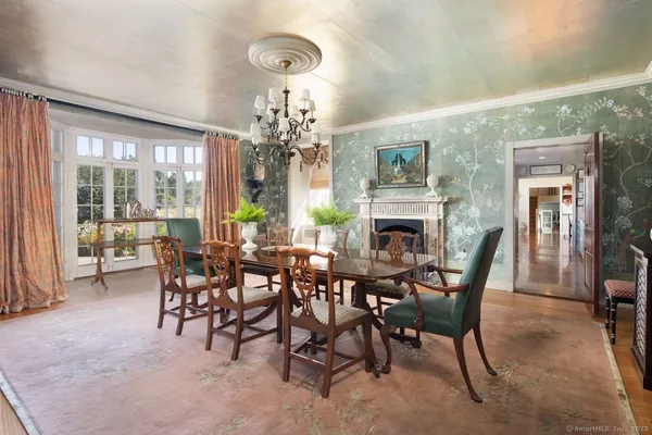 a view of a dining room with furniture window and outside view