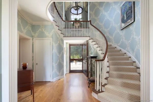 a view of entryway with wooden floor