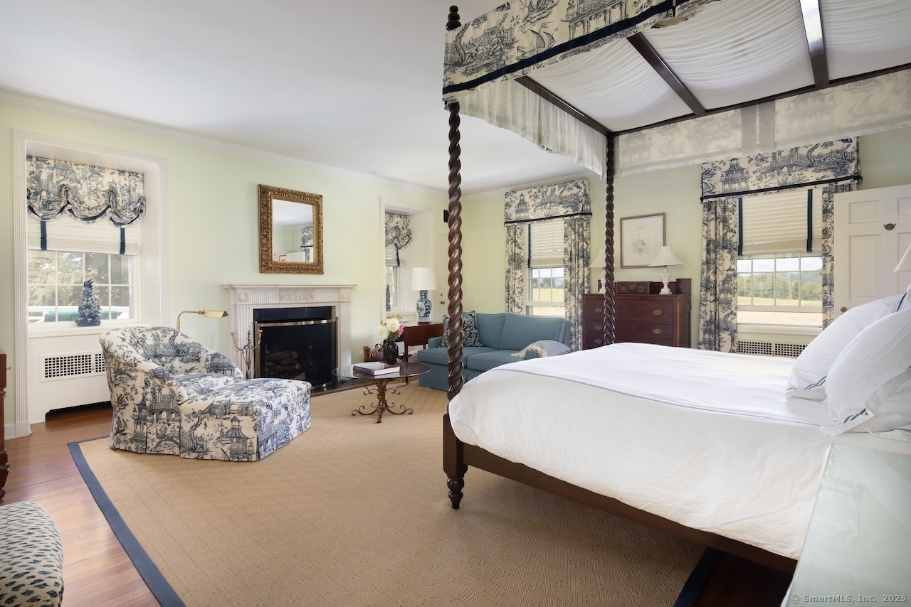 406 Wells Hill Road Salisbury, CT 06039 - Photo 25 of 38 a spacious bedroom with a bed a couch and dresser