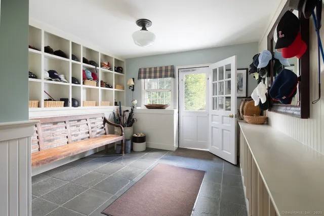 a bedroom with furniture and a book shelf