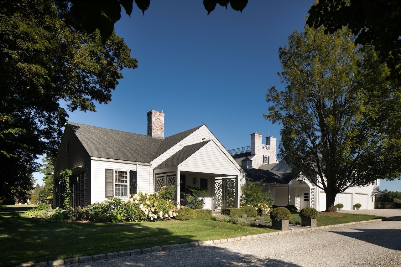 406 Wells Hill Road Salisbury, CT 06039 - Photo 36 of 38 a front view of a house with garden
