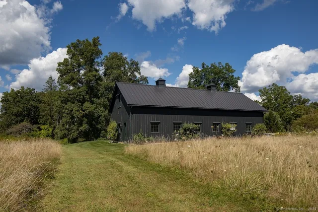 a backyard of a house with lots of green space