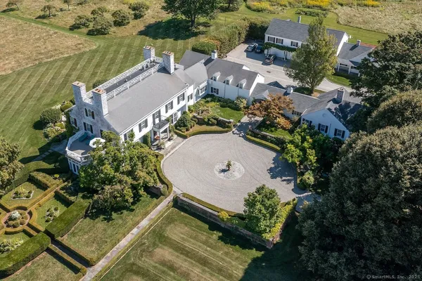 an aerial view of a house with a lake view