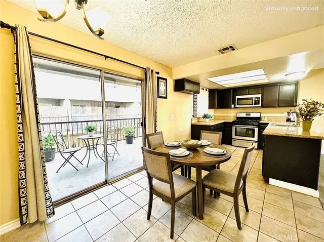 a view of a dining room with furniture and a table