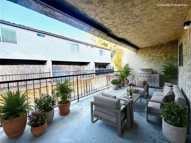 a lobby with furniture and potted plants