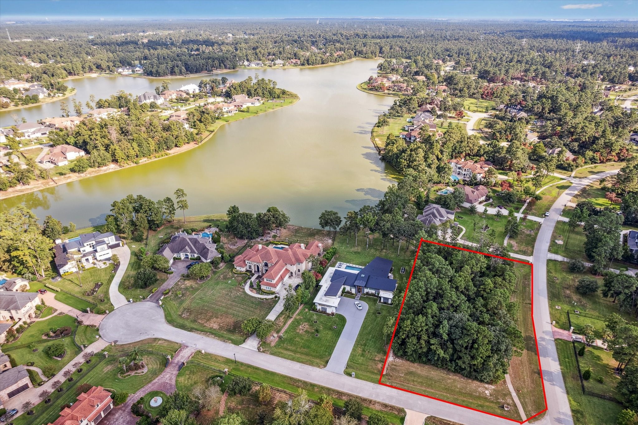 4502 Siandra Creek Court Spring, TX 77386 - Photo 2 of 10 an aerial view of lake and residential houses with outdoor space