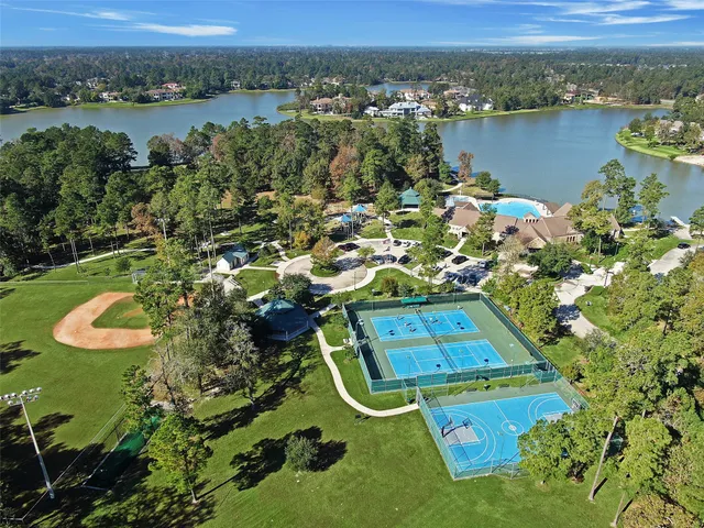 an aerial view of a house with a lake view