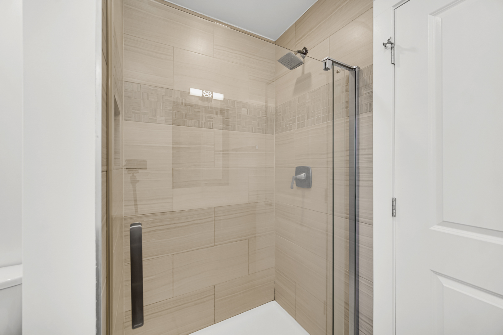 5817 Crain Street Morton Grove, IL 60053 - Photo 14 of 20 a bathroom with a shower