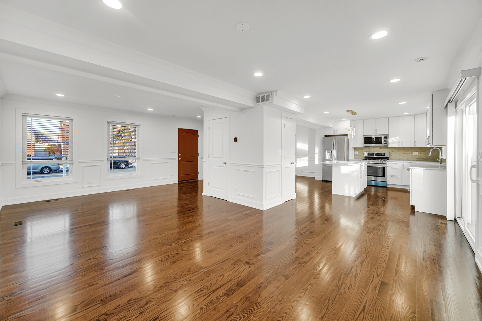 5817 Crain Street Morton Grove, IL 60053 - Photo 5 of 20 a view of kitchen dining table chairs microwave and cabinets