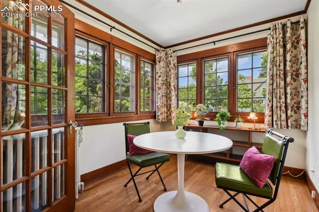 a view of a dining room with furniture window and wooden floor