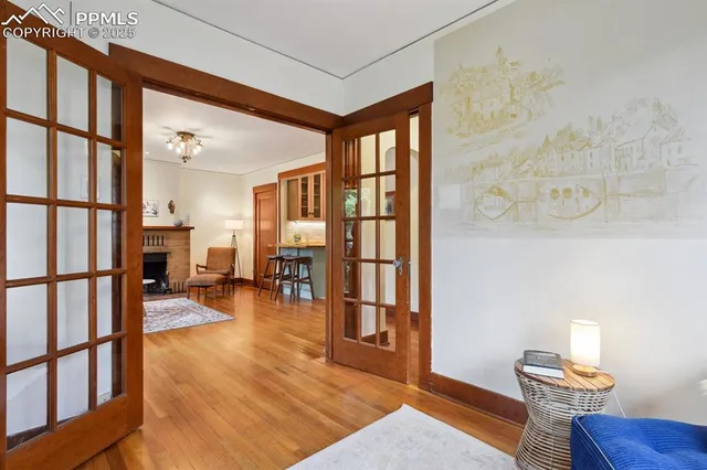 a view of a livingroom with furniture and hardwood floor
