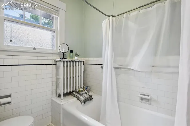 a bathroom with a sink a toilet and a bathtub