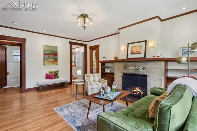 a living room with furniture and a fireplace