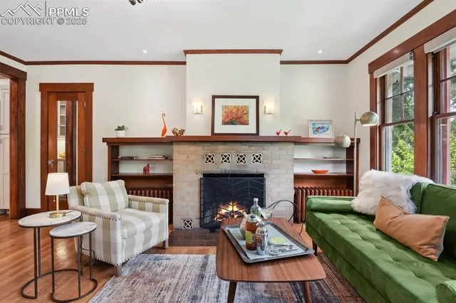 a living room with furniture and a fireplace