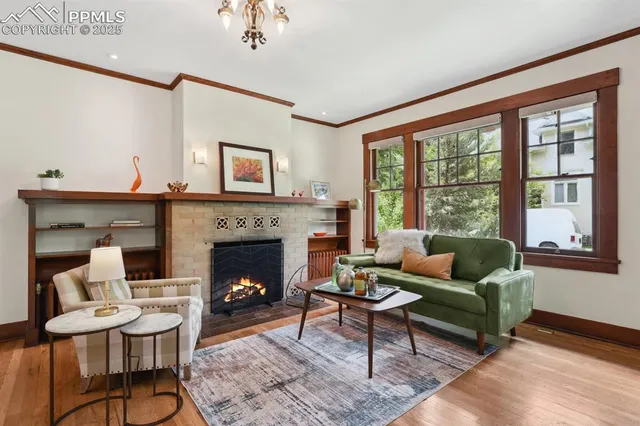a living room with furniture and a fireplace