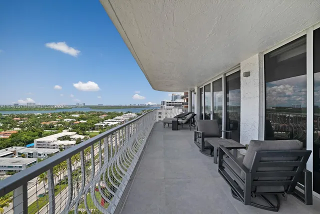 a balcony with furniture and outdoor view
