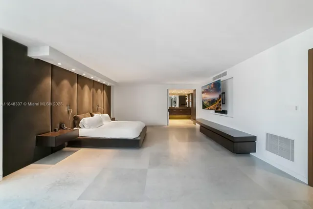 a bedroom with furniture and window