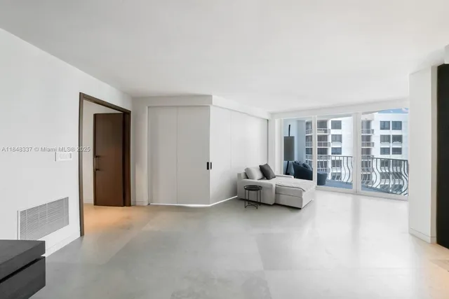 a bed room with a bed and a television