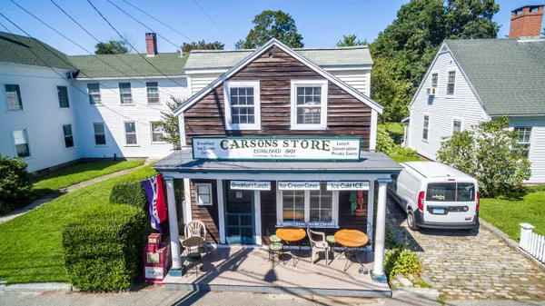 an aerial view of a house with a garden