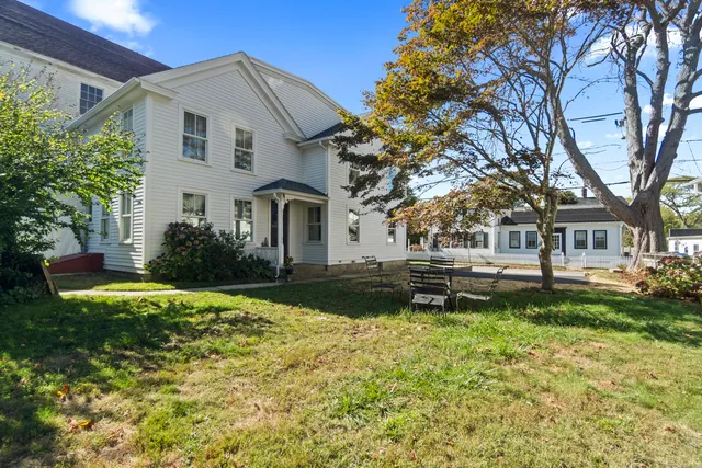 an aerial view of a house with outdoor space