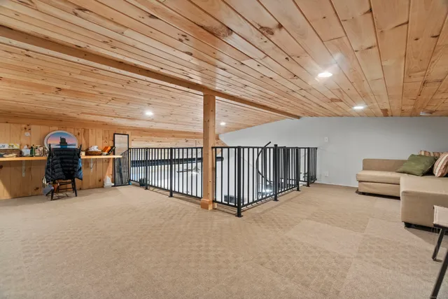 a picture of a bench in front of a wall