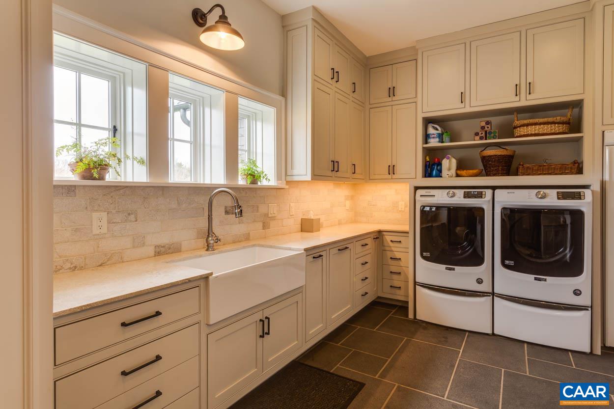 361 Union Mills Road Troy, VA 22974 - Photo 29 of 75 a kitchen with stainless steel appliances granite countertop white cabinets and window