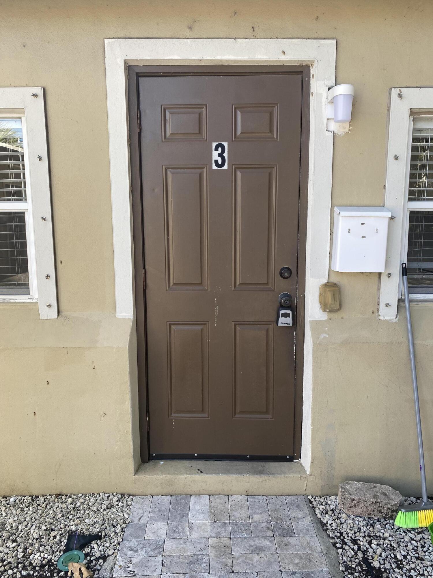 a view of a hallway with wooden door
