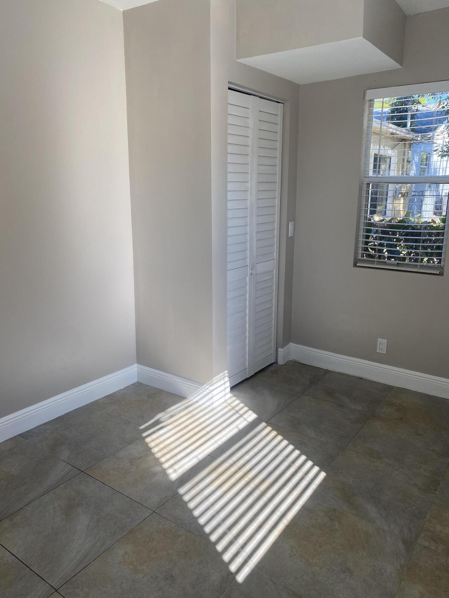 508 57th Street, Unit 3 West Palm Beach, FL 33407 - Photo 12 of 23 a view of an empty room and window