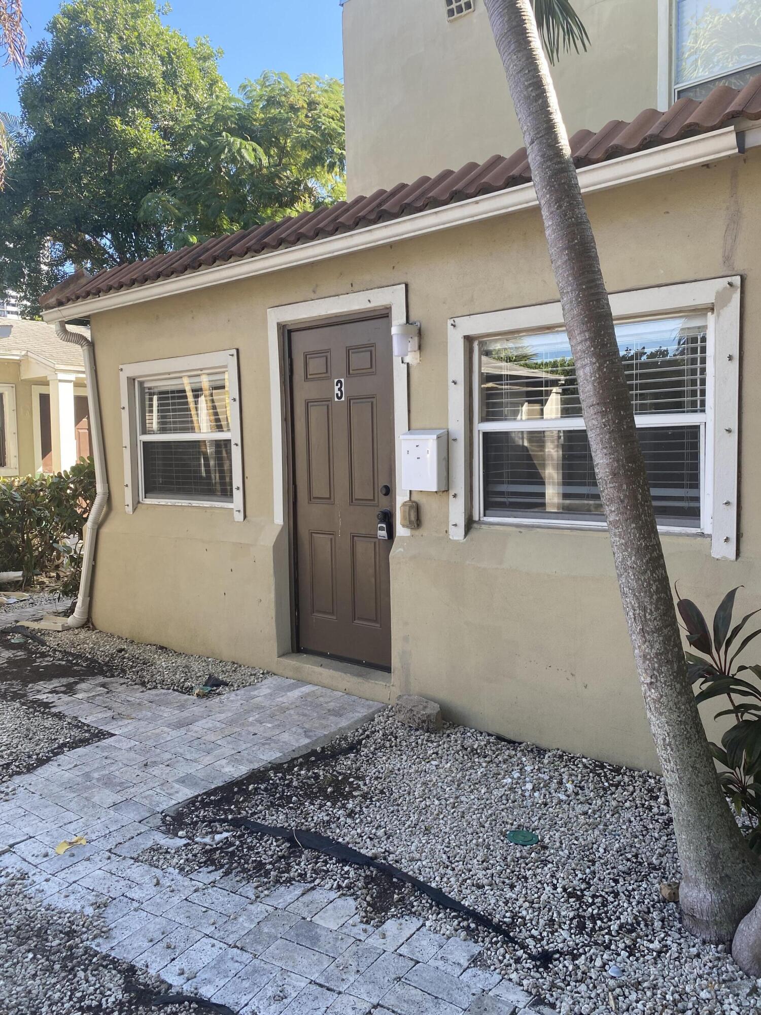 508 57th Street, Unit 3 West Palm Beach, FL 33407 - Photo 2 of 23 a view of a house with a outdoor space