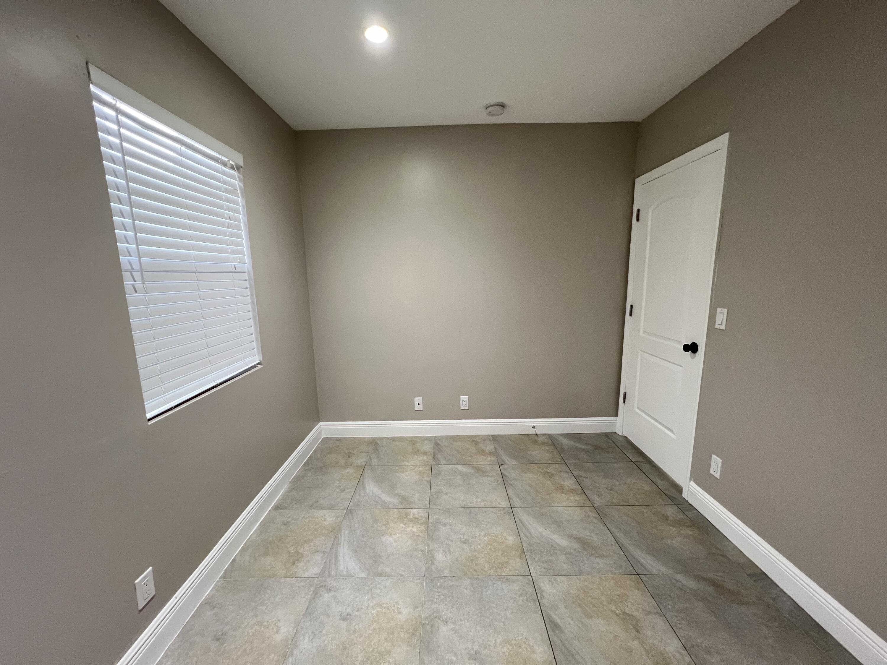 508 57th Street, Unit 3 West Palm Beach, FL 33407 - Photo 22 of 23 an empty room with windows