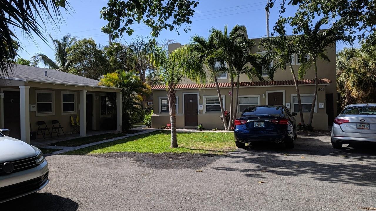 508 57th Street, Unit 3 West Palm Beach, FL 33407 - Photo 3 of 23 a view of a car parked in front of house