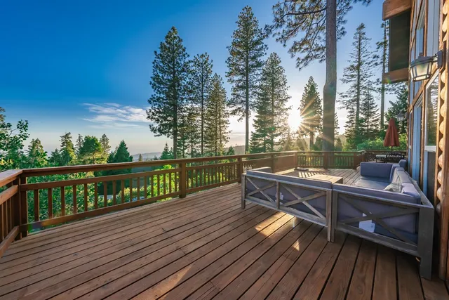 a view of balcony with wooden floor and outdoor seating