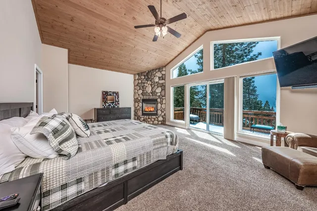 a living room with furniture and a ceiling fan