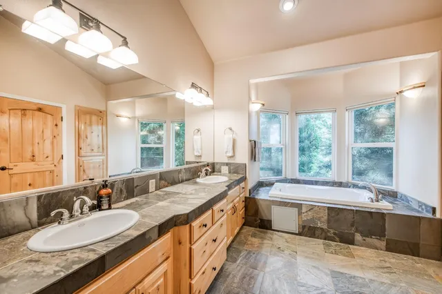 a view of a house with a yard and sitting area