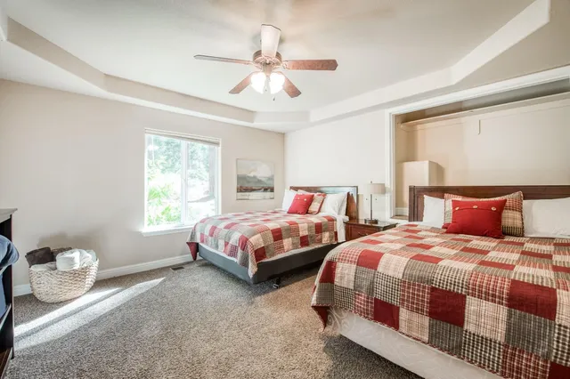 a view of a city with lush green forest